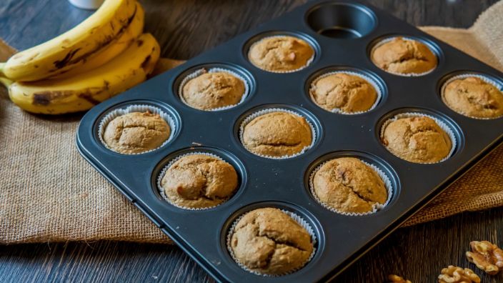 muffin tin with bananas near