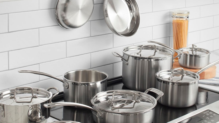 stainless steel pans on a stove top